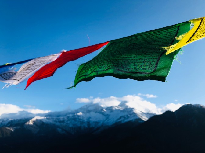 Mountain Peaks with Vibrant Religious Flags
